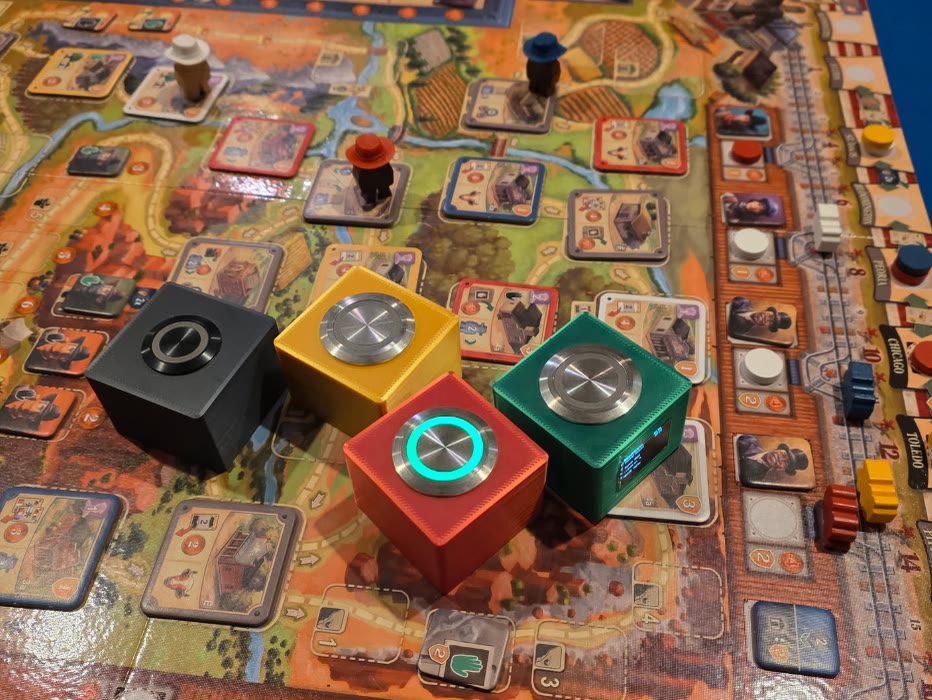 Four OLO buttons on a board game, the red one lit for its turn